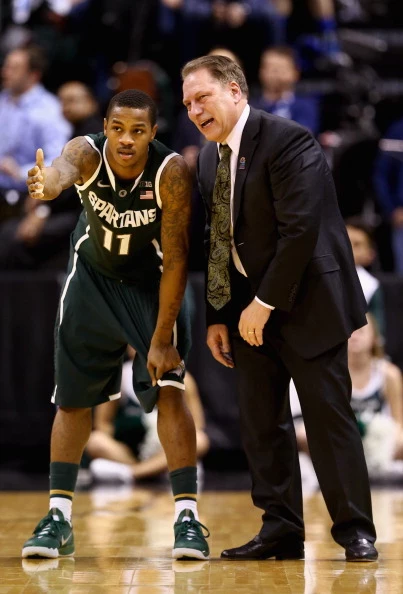 Head coach Tom Izzo of the Michigan State Spartans speaks to Keith Appling #11 during the second half of the Big Ten Basketball Tournament Semifinal game against the Wisconsin Badgers at Bankers Life Fieldhouse on March 15, 2014 in Indianapolis, Indiana.