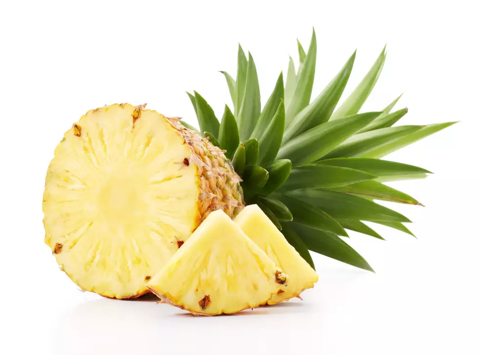 Sliced open pineapple fruit slices